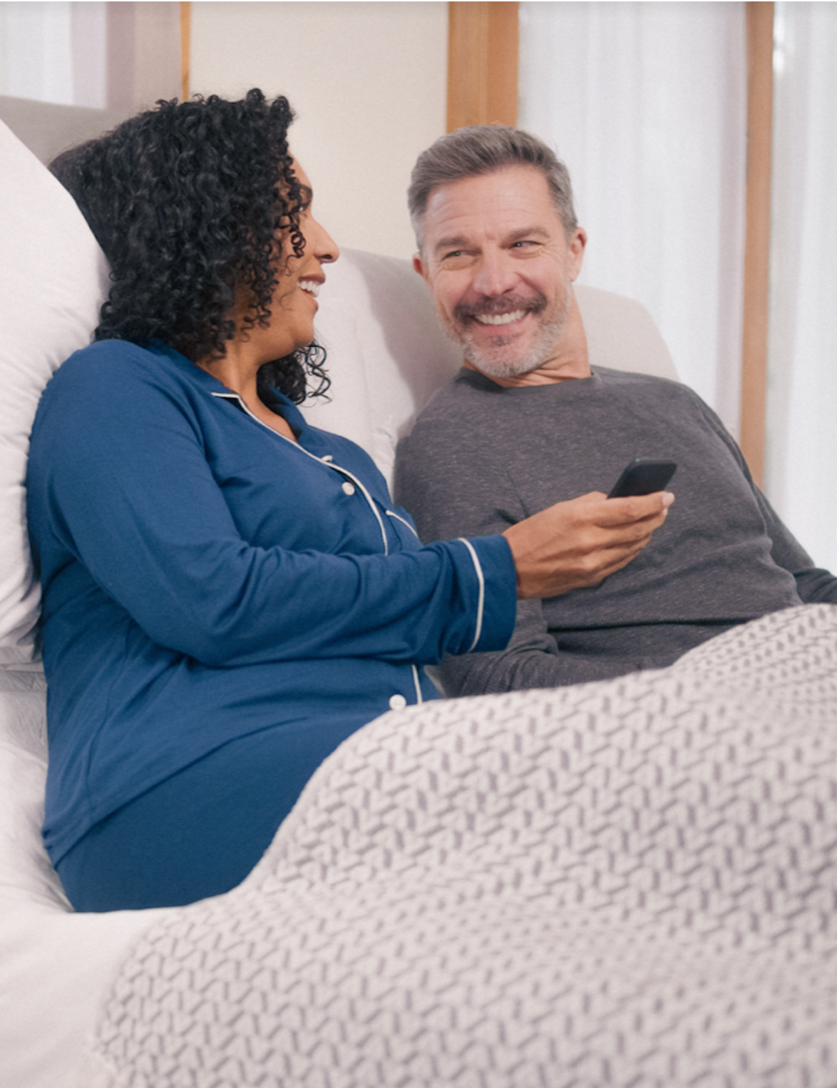 couple on adjustable bed frame